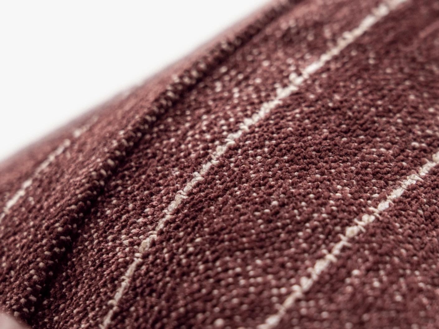 Noa Scarlet cushion in white and red, shown in a product close-up as image 7