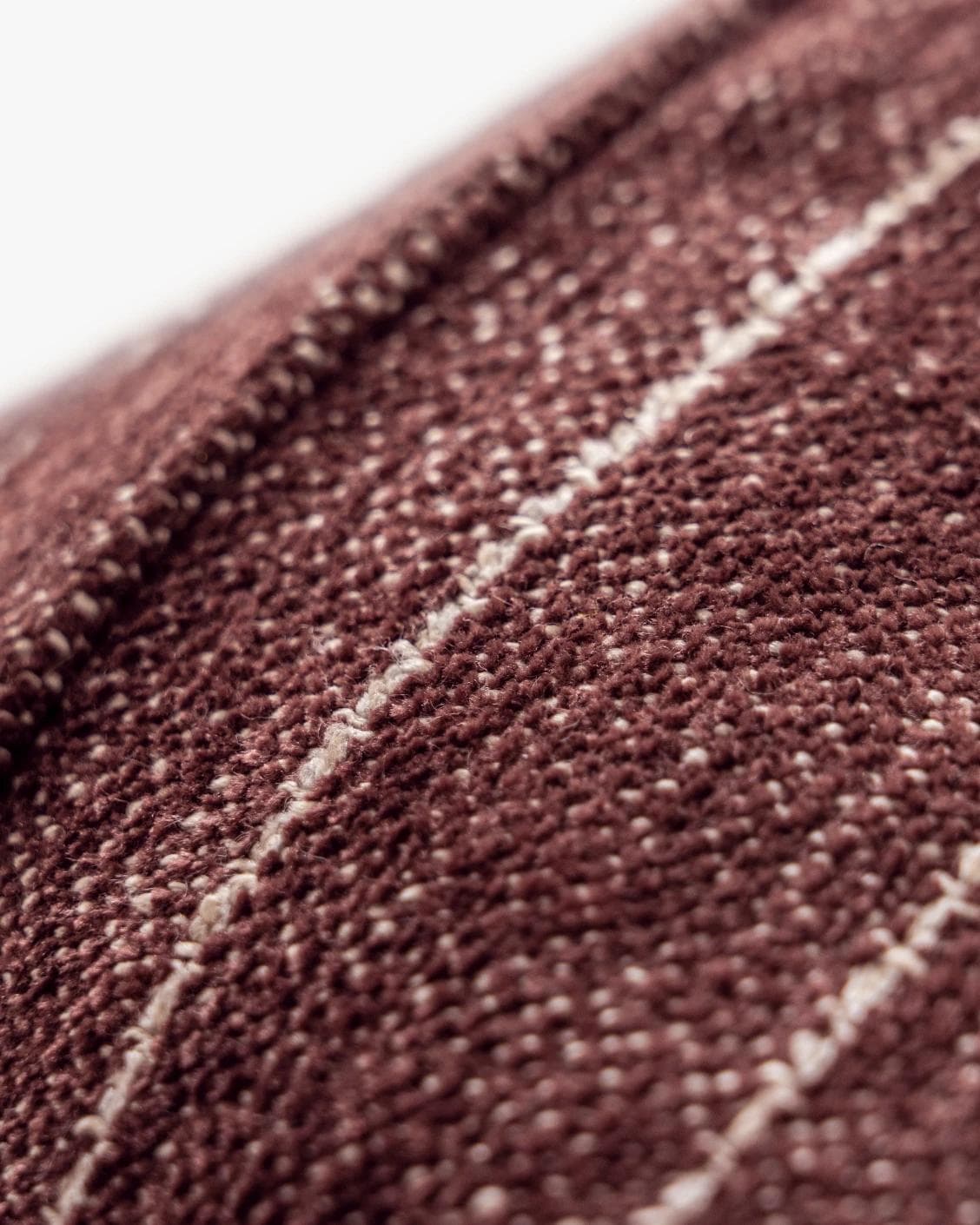 Noa Scarlet cushion in white and red, shown in a product close-up as image 7