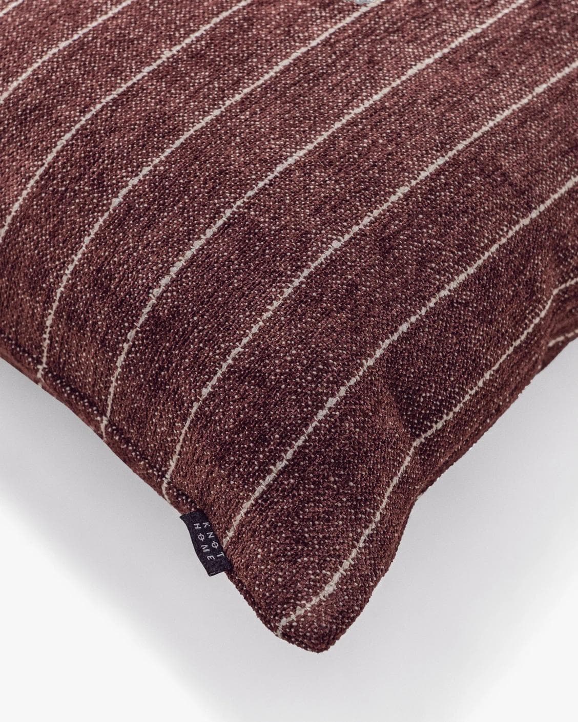 Noa Scarlet cushion in white and red, shown in a product top view as image 9