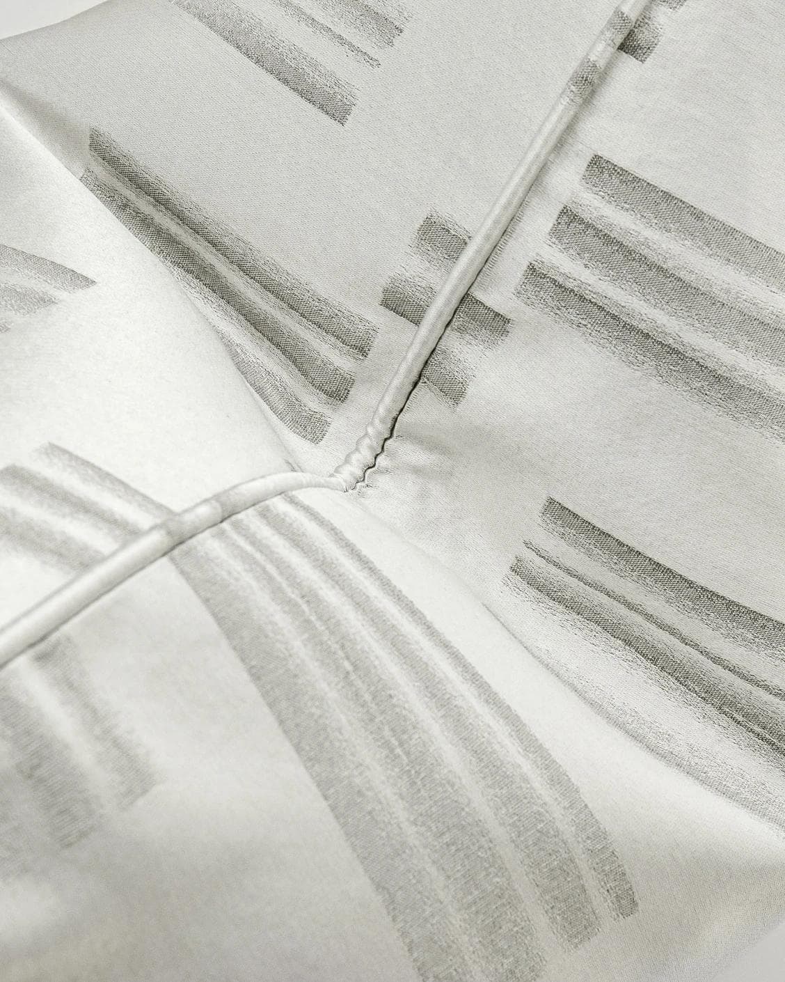 Nolan Laurent cushion in silver and grey, shown in a product top view as image 7