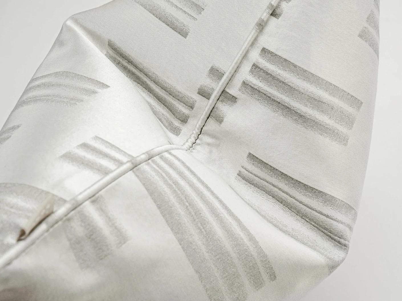 Nolan Laurent cushion in silver and grey, shown in a product top view as image 7