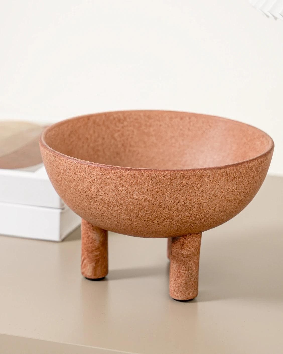 Nuva Terra bowls in orange, shown in a lifestyle front view as image 2