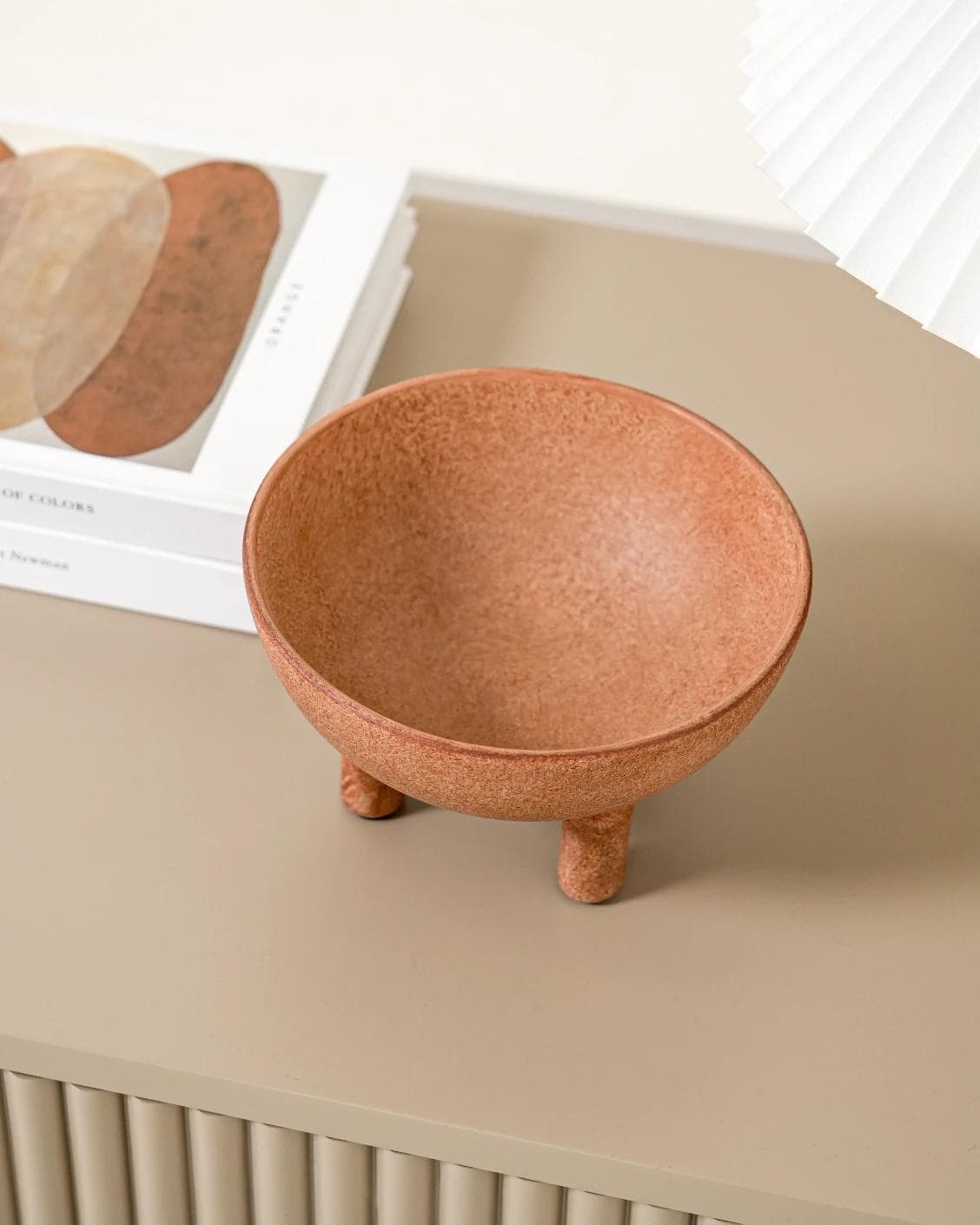 Nuva Terra bowls in orange, shown in a lifestyle top view as image 6