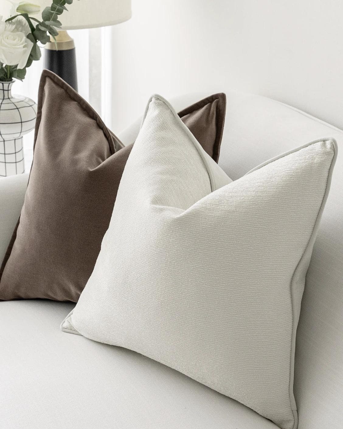 Oliver Bundle cushion in brown, white and silver, shown in a lifestyle right view as image 5