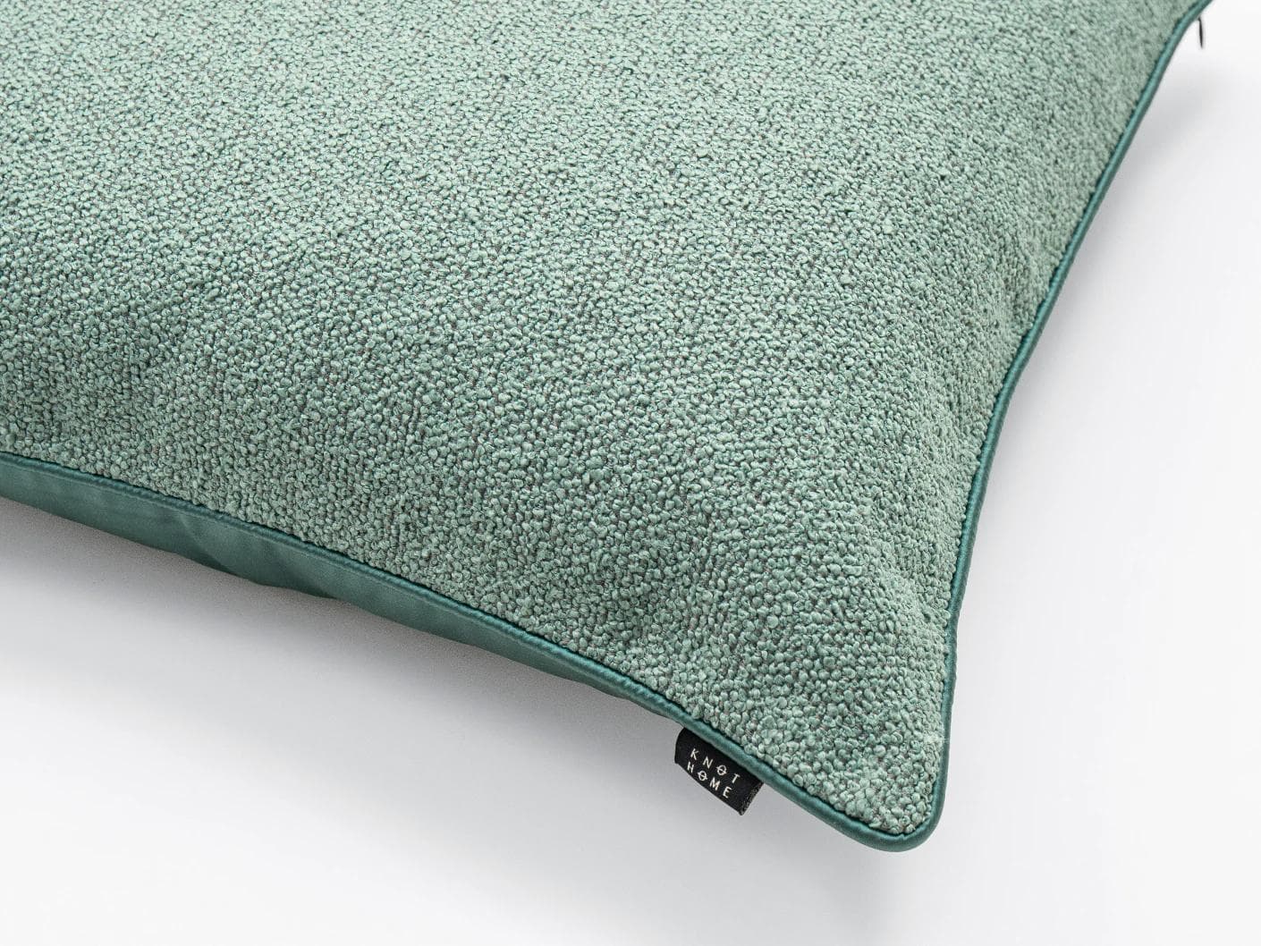 Oliver Sage cushion in green, shown in a product close-up as image 5