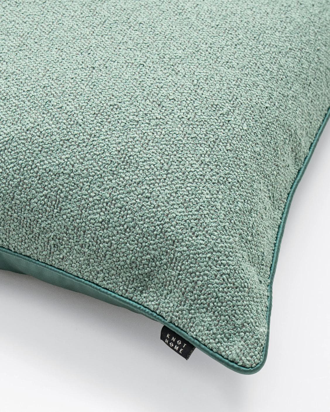 Oliver Sage cushion in green, shown in a product close-up as image 5