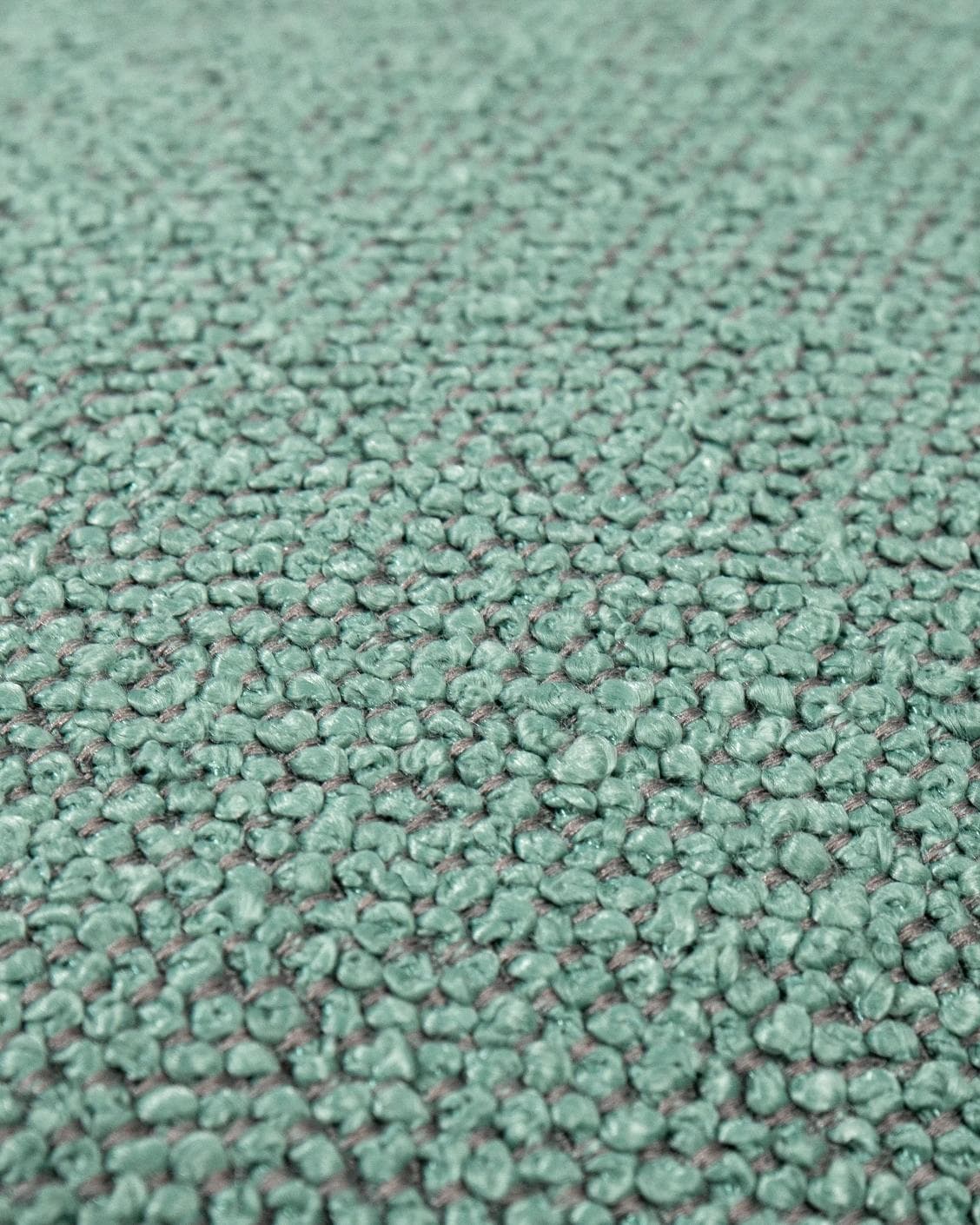 Oliver Sage cushion in green, shown in a product close-up as image 6