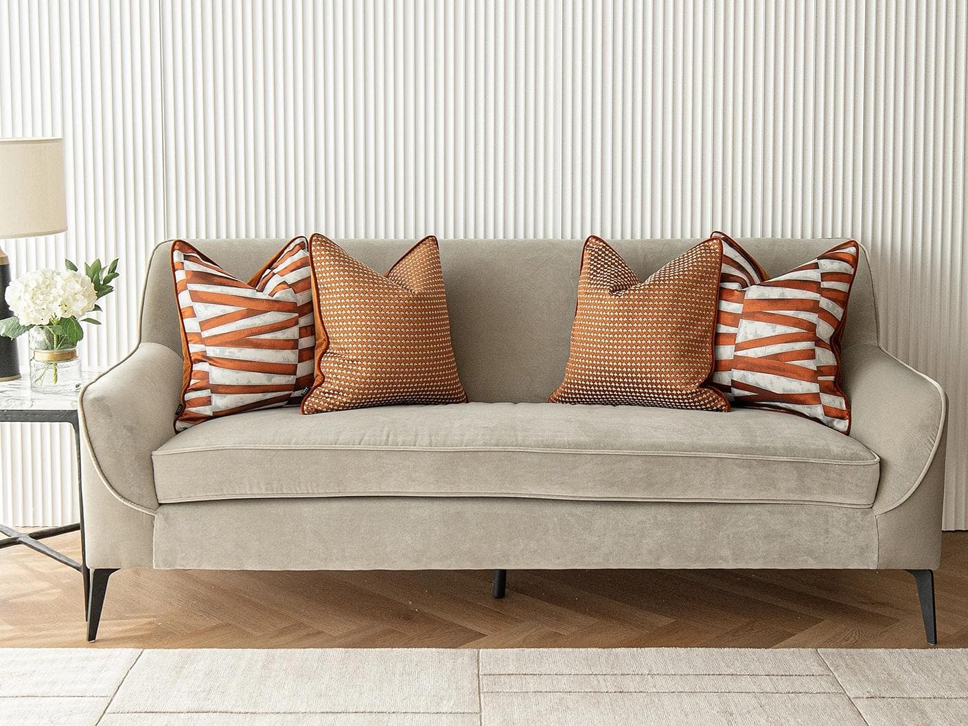 Alfred Bundle cushion in orange and white, shown in a lifestyle front view as image 4