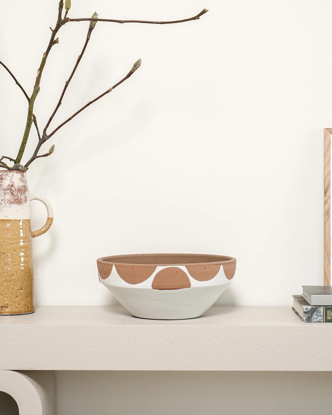 Oris Terra bowls in soft ivory, beige and white, shown in a lifestyle front view as image 5