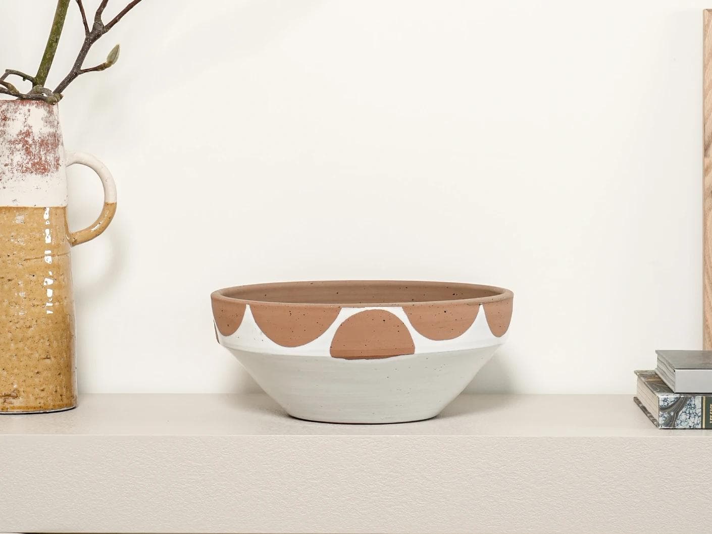 Oris Terra bowls in soft ivory, beige and white, shown in a lifestyle front view as image 5