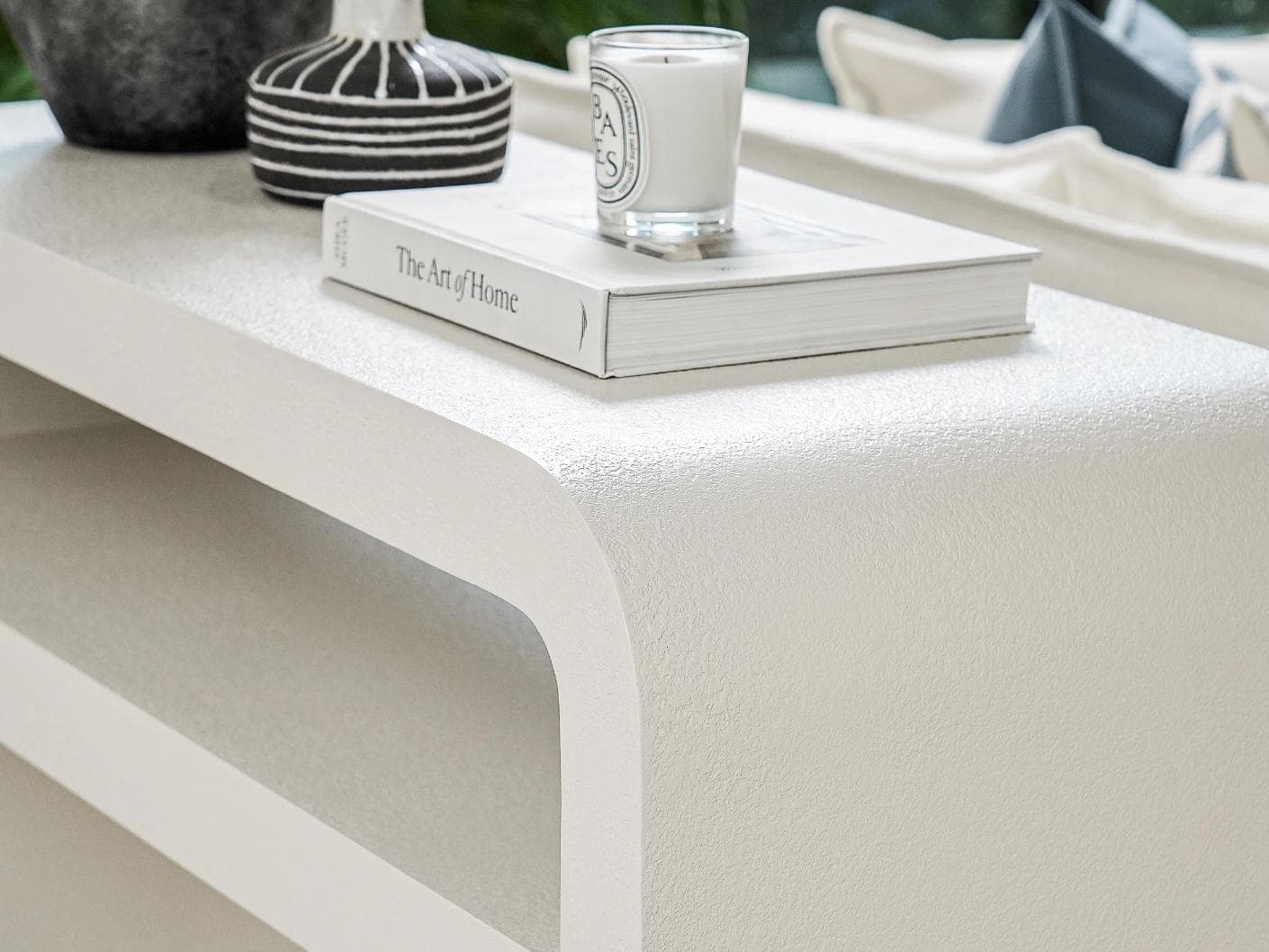 Orta console table in soft ivory and stone, shown in a lifestyle right view as image 5