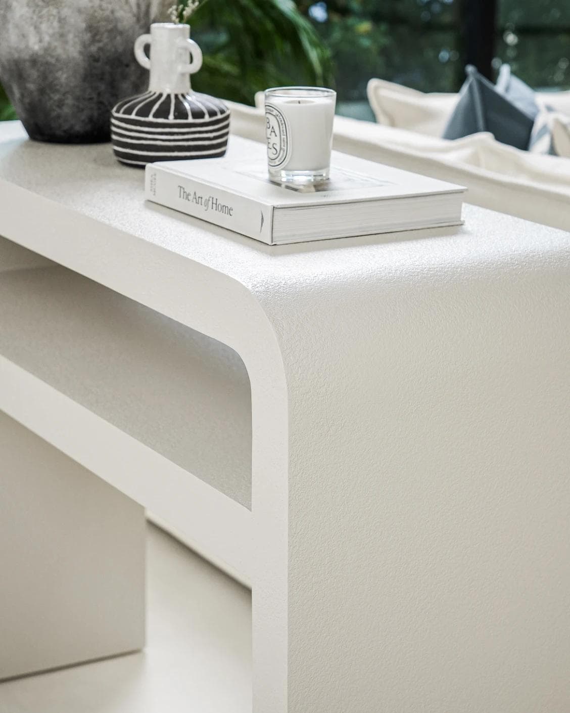 Orta console table in soft ivory and stone, shown in a lifestyle right view as image 5