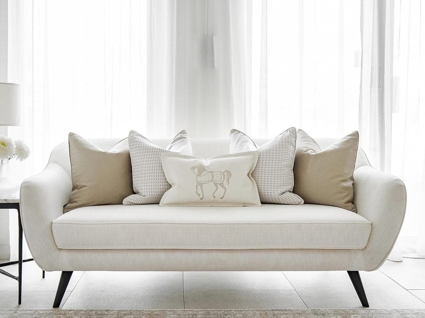 Elgine Bundle cushion in gold, beige and white, shown in a lifestyle front view as image 4