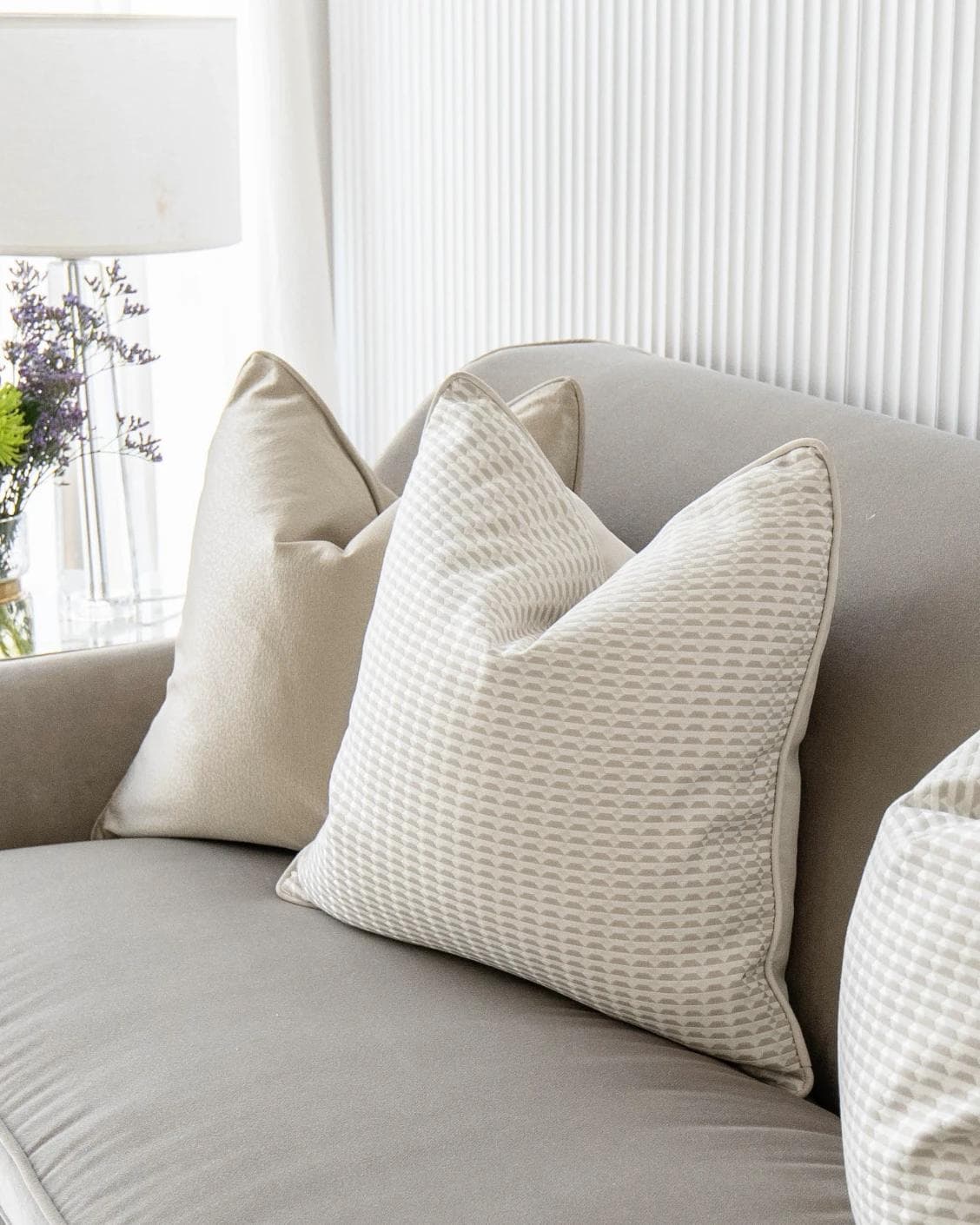 Adeline Bundle cushion in gold, beige and white, shown in a lifestyle right view as image 5