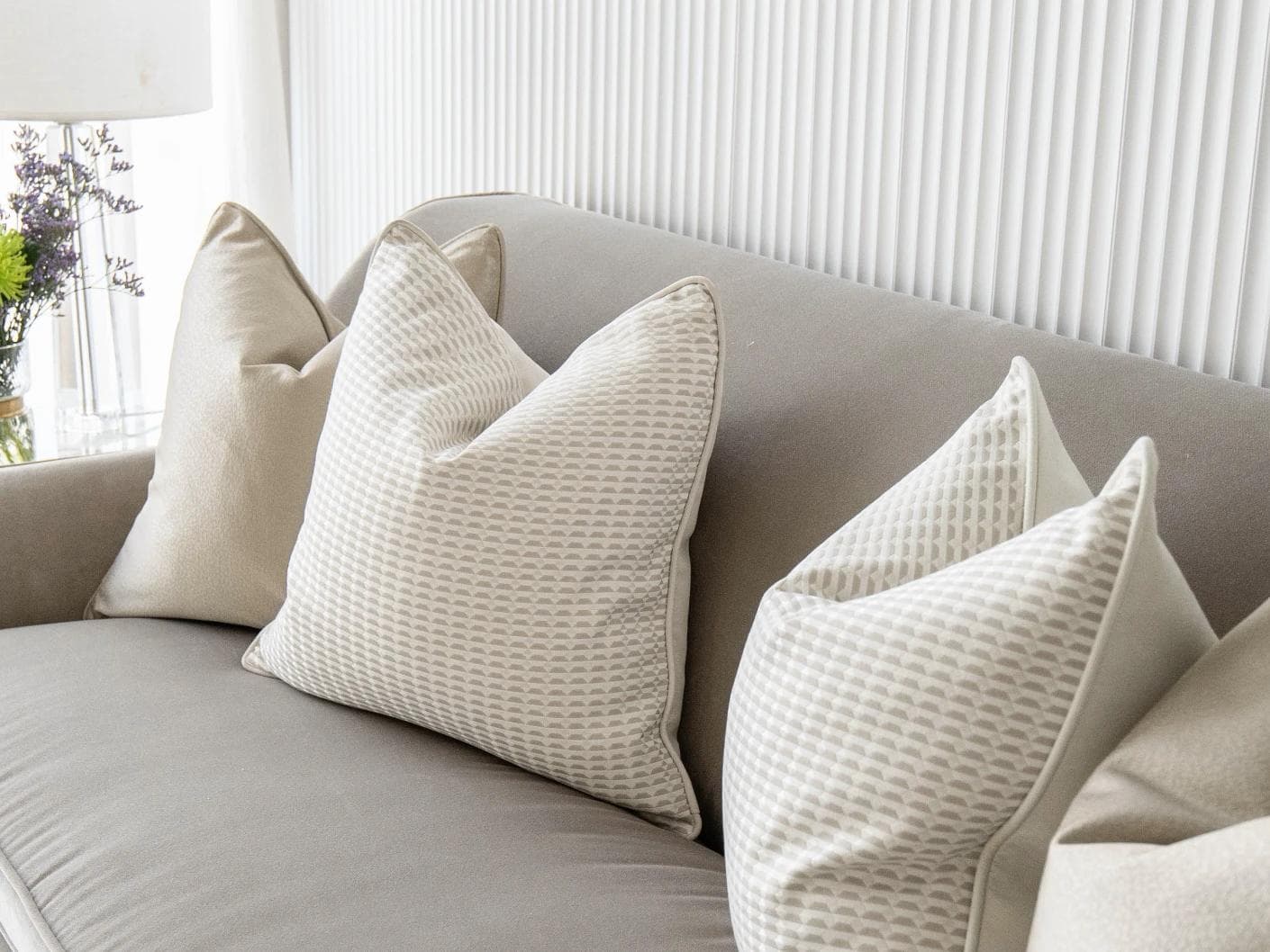 Adeline Bundle cushion in gold, beige and white, shown in a lifestyle right view as image 5