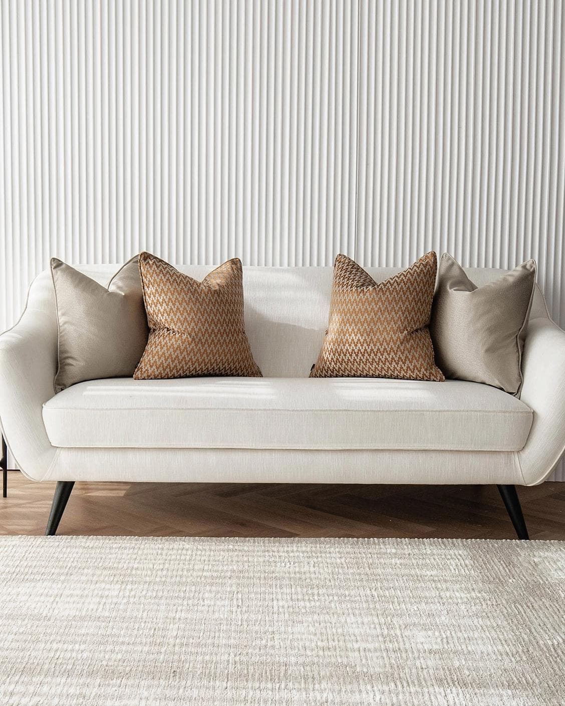 Amalia Bundle cushion in gold, orange and beige, shown in a lifestyle front view as image 4