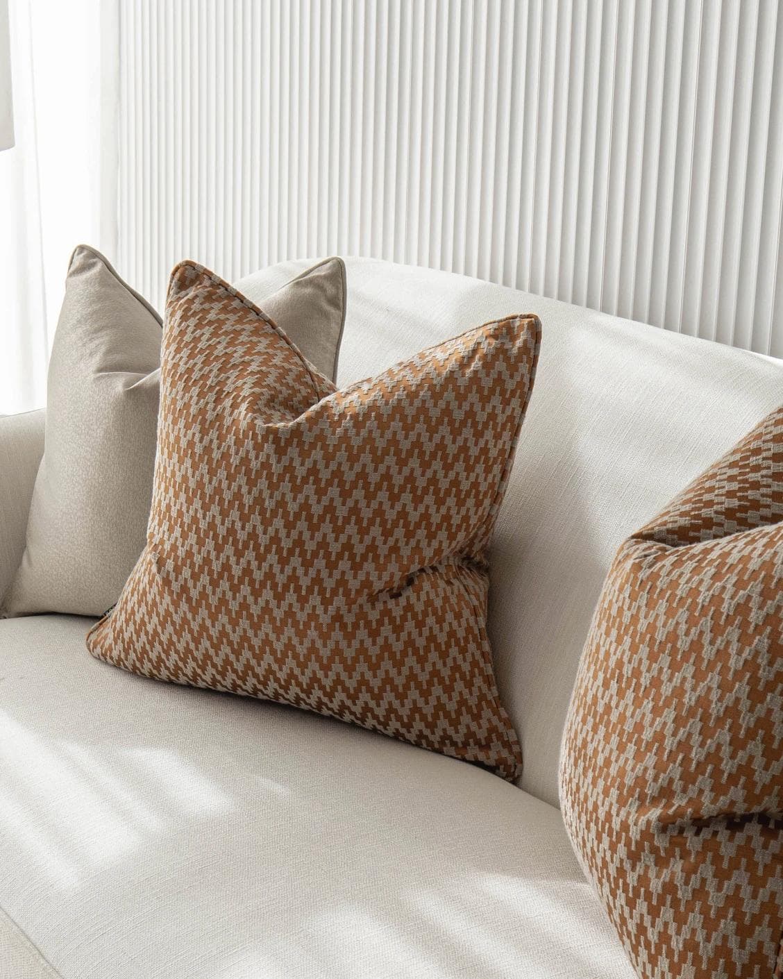 Amalia Bundle cushion in gold, orange and beige, shown in a lifestyle right view as image 5