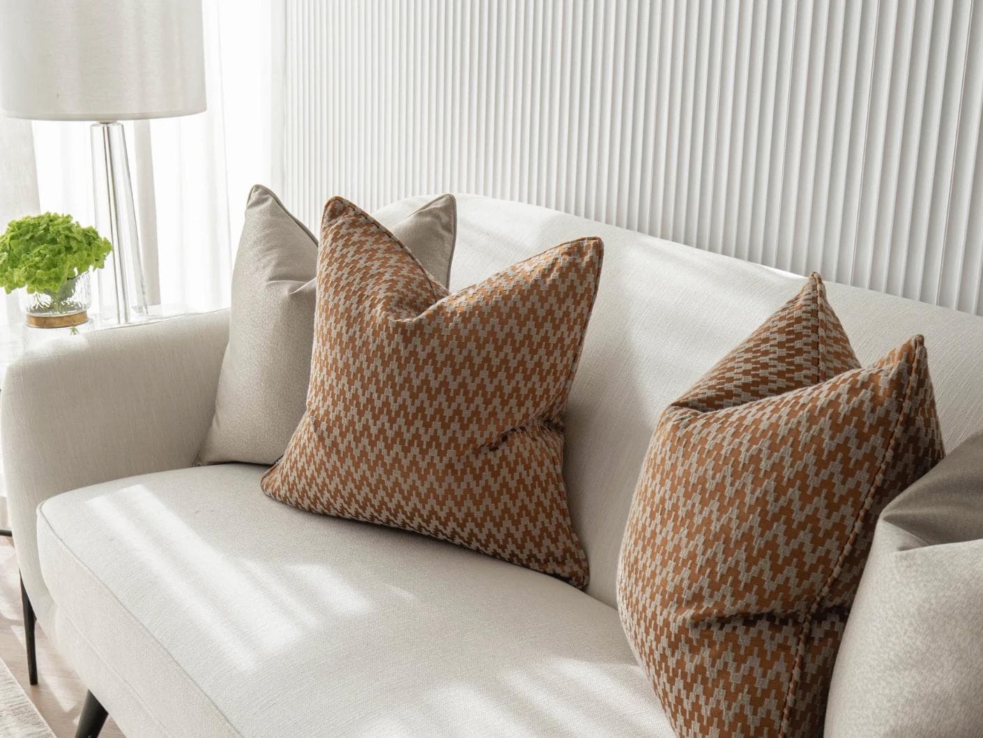 Amalia Bundle cushion in gold, orange and beige, shown in a lifestyle right view as image 5
