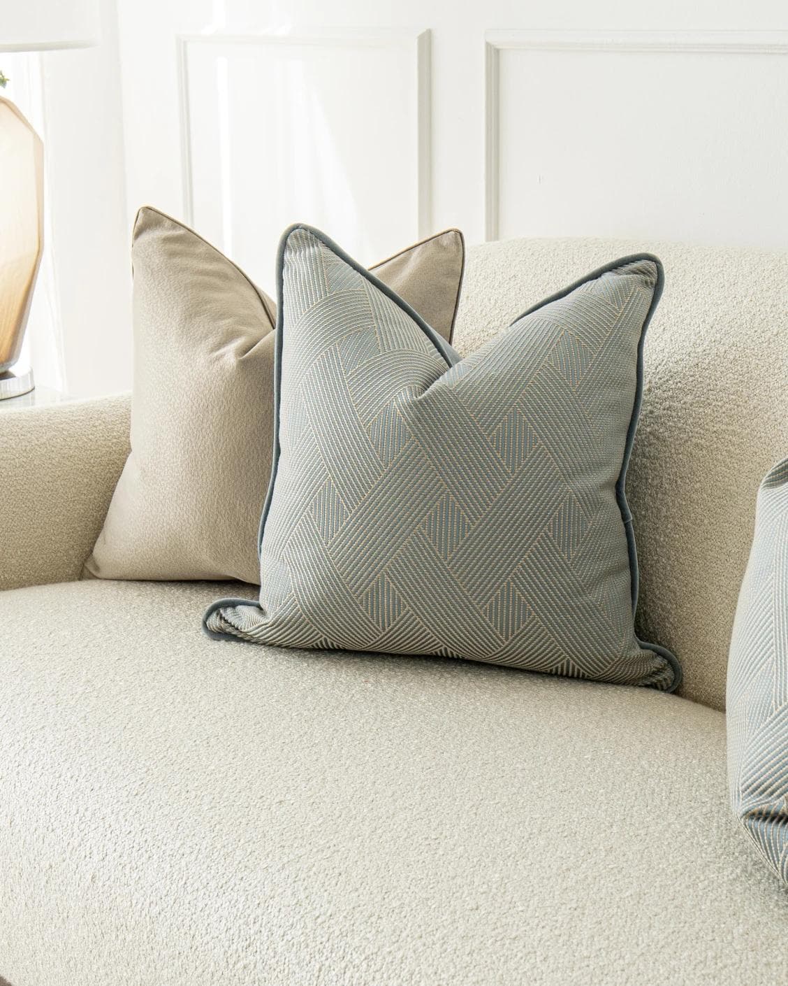 Juno Bundle cushion in gold, beige and blue, shown in a product right view as image 5