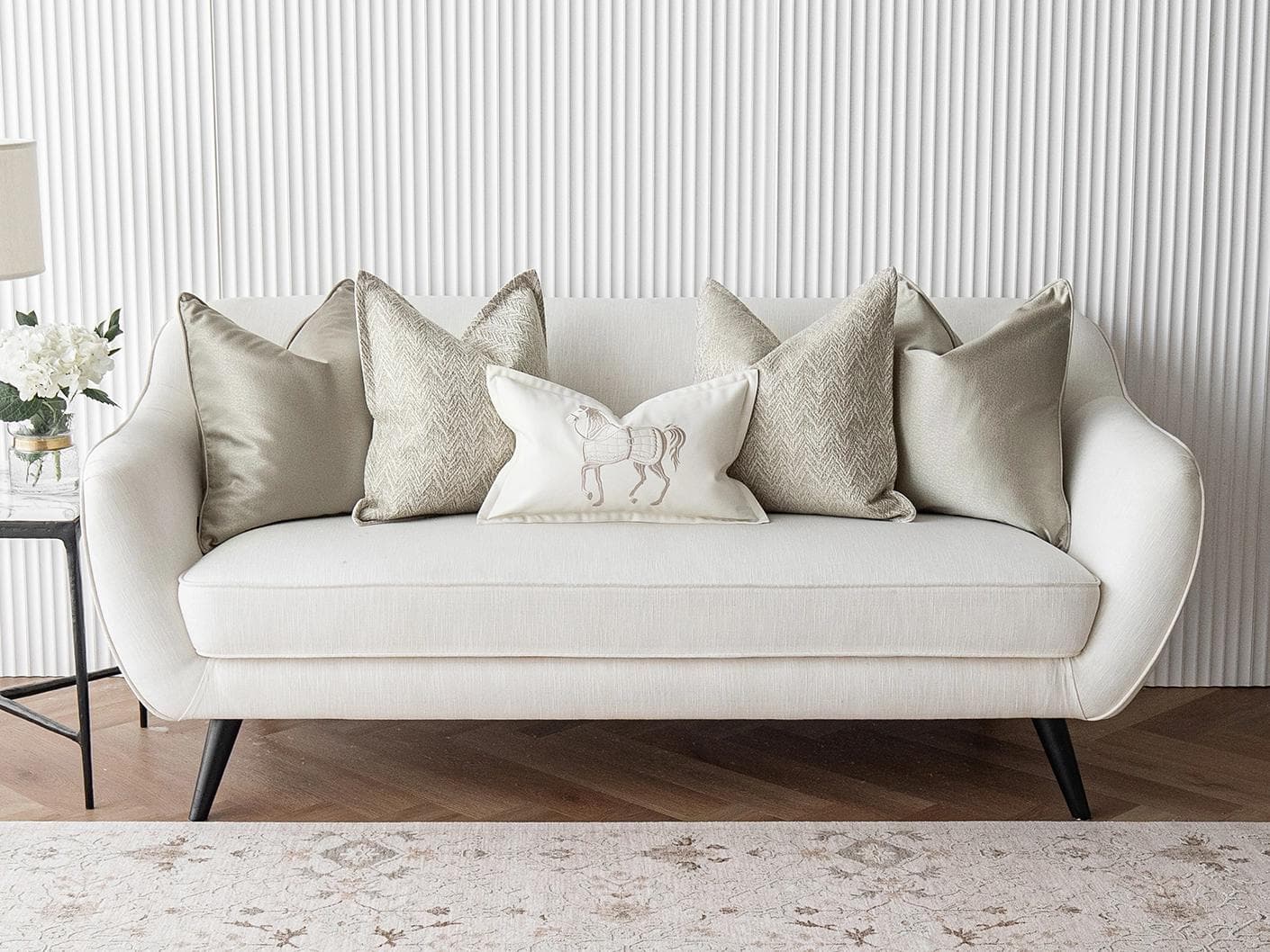 Sugar Bundle cushion in gold, beige and white, shown in a lifestyle front view as image 4