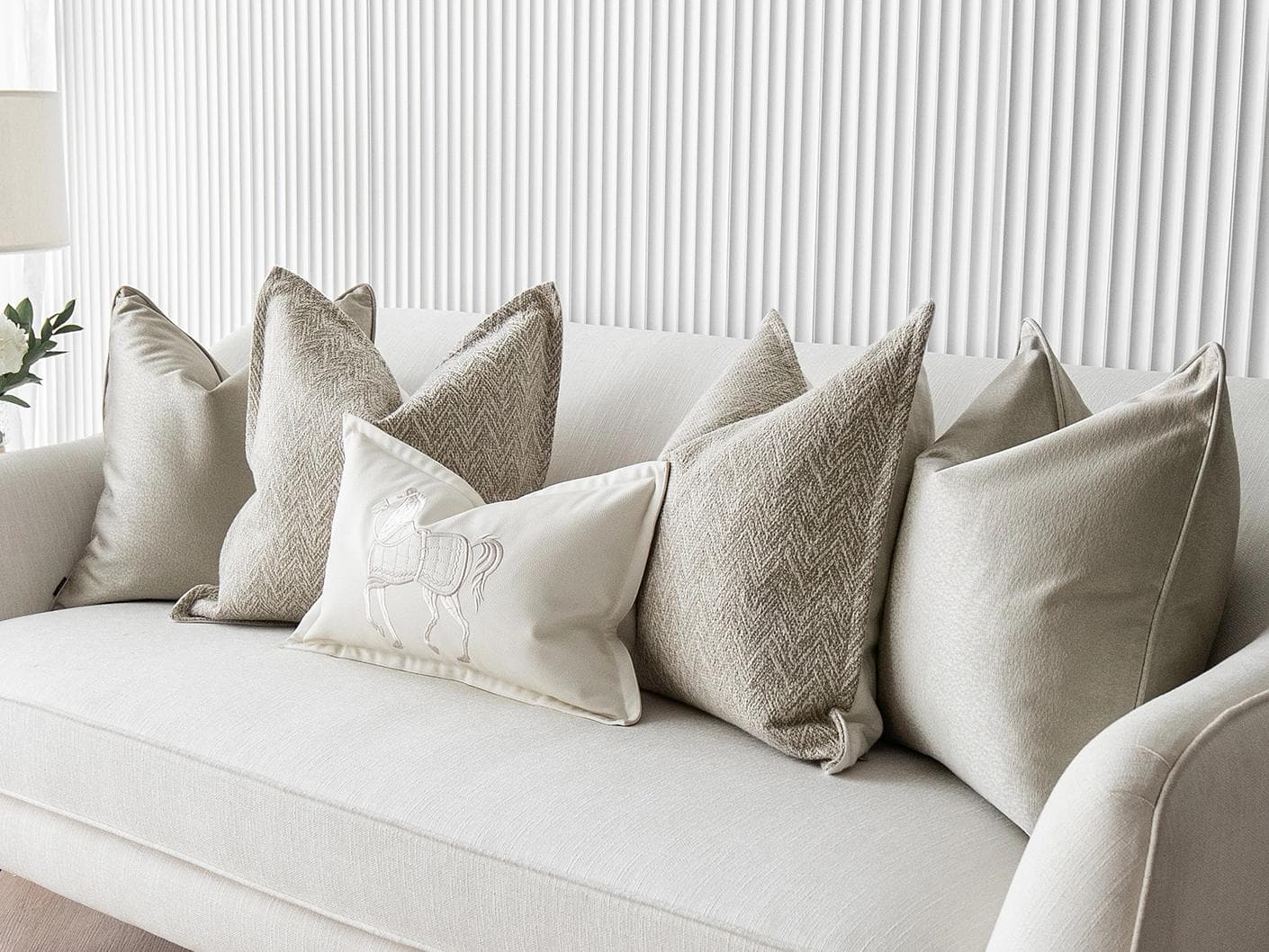 Sugar Bundle cushion in gold, beige and white, shown in a lifestyle right view as image 2