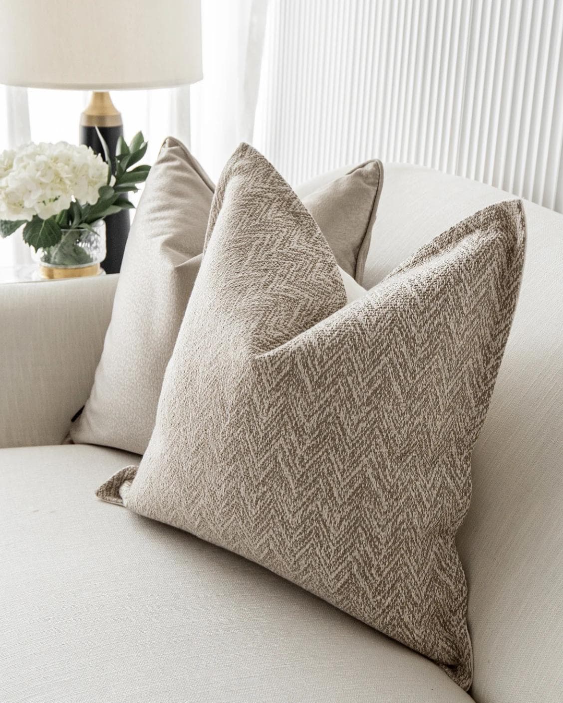 Sugar Bundle cushion in gold, beige and white, shown in a lifestyle right view as image 5