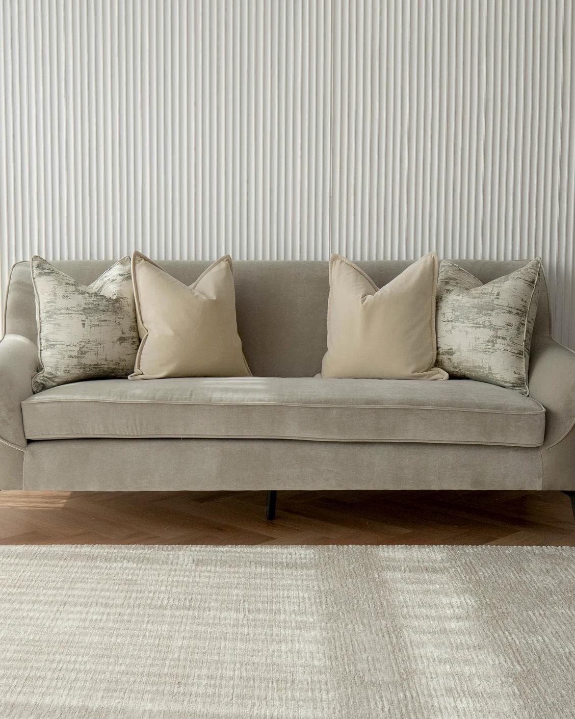 Jennica Bundle cushion in beige, grey and white, shown in a lifestyle front view as image 4