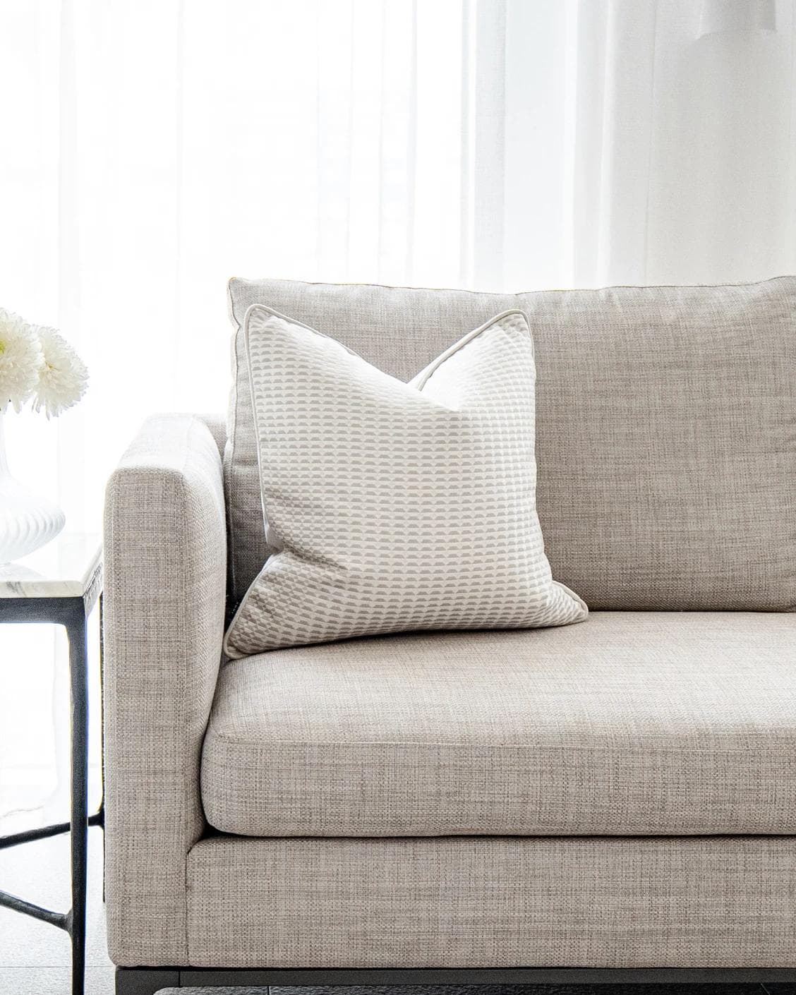 Paola Laurent cushion in white and beige, shown in a lifestyle as image 4