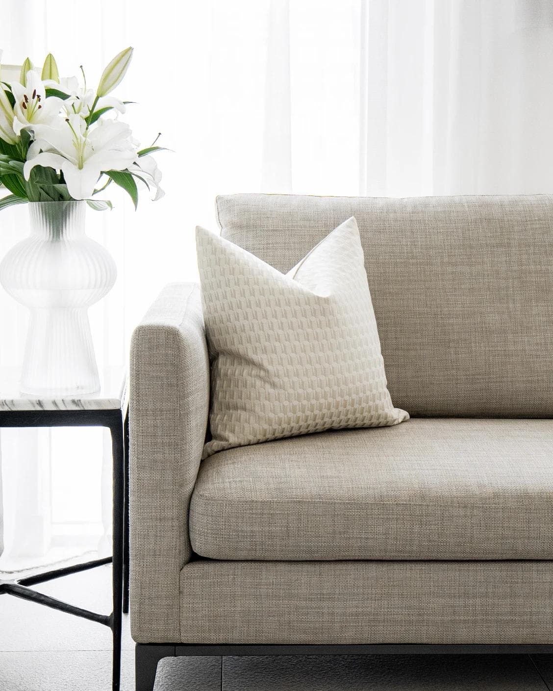 Paul Bianca cushion in white and beige, shown in a lifestyle front view as image 4