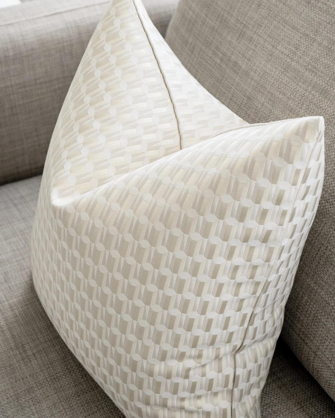 Paul Bianca cushion in white and beige, shown in a lifestyle top view as image 5