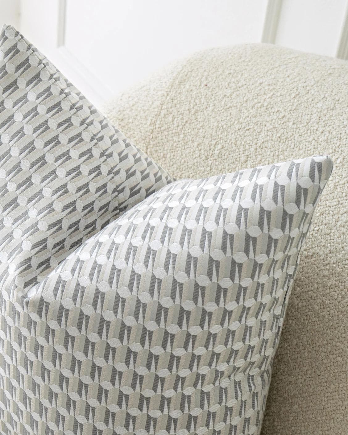Paul Canova cushion in grey, shown in a lifestyle top view as image 6