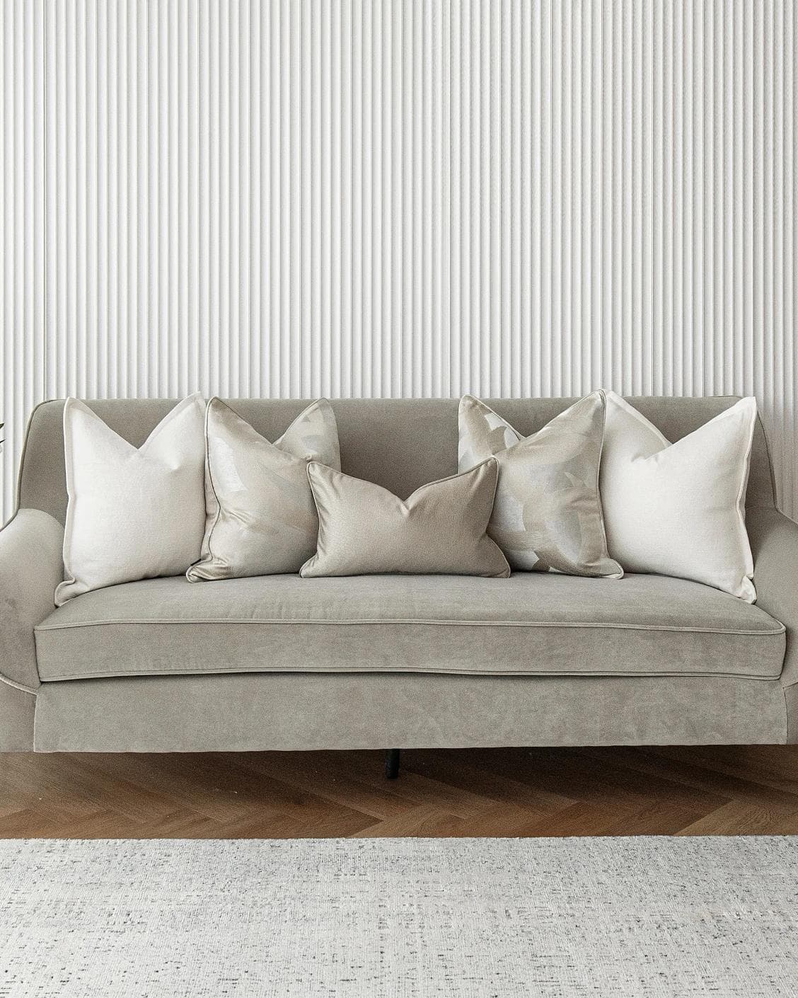 Harry Bundle cushion in gold, beige, silver and white, shown in a lifestyle front view as image 2