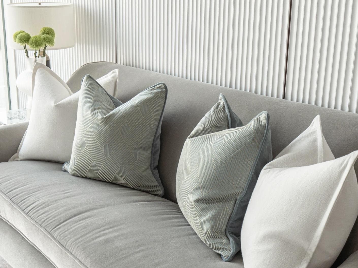 Tyler Bundle cushion in white and blue, shown in a lifestyle right view as image 5