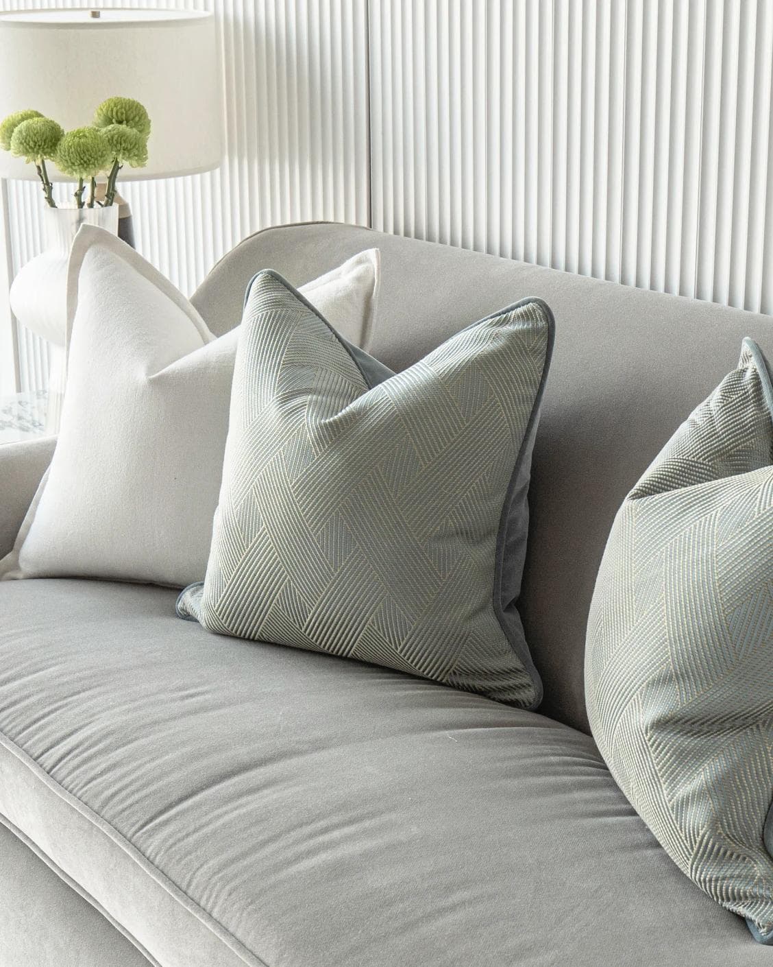Tyler Bundle cushion in white and blue, shown in a lifestyle right view as image 5