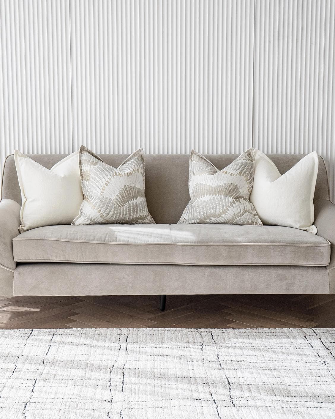 Stella Bundle cushion in white, brown and grey, shown in a lifestyle front view as image 4