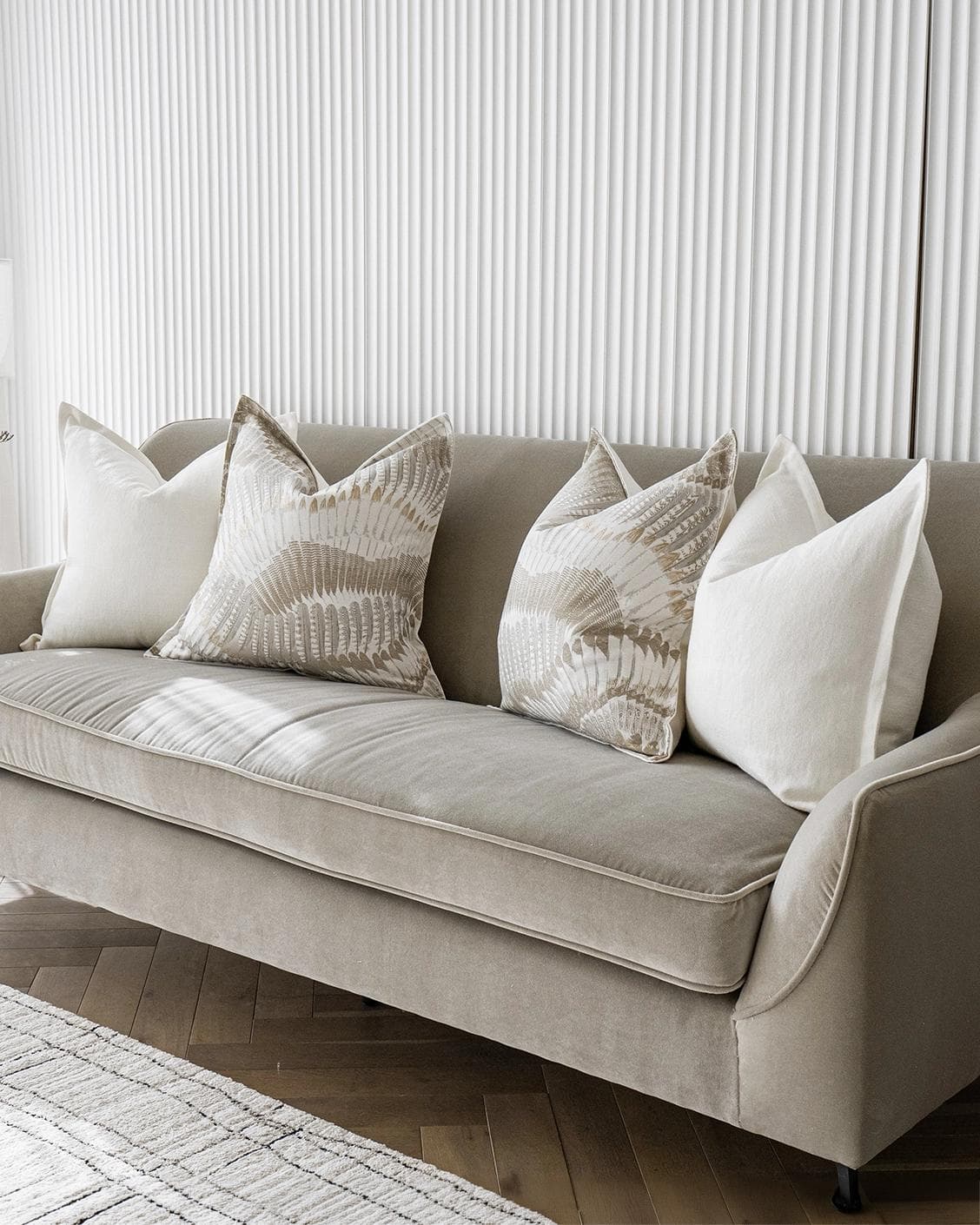 Stella Bundle cushion in white, brown and grey, shown in a lifestyle right view as image 2