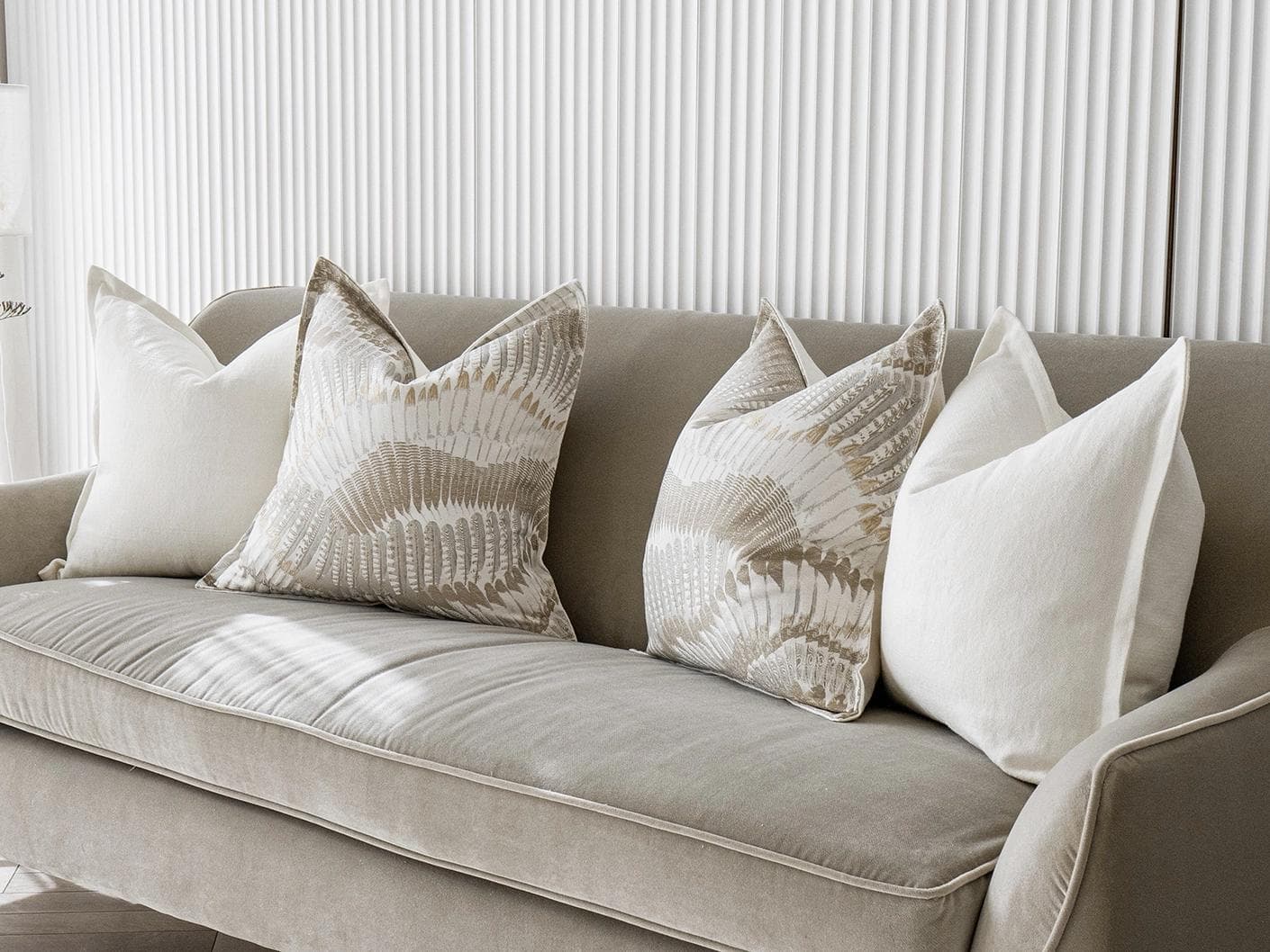 Stella Bundle cushion in white, brown and grey, shown in a lifestyle right view as image 2