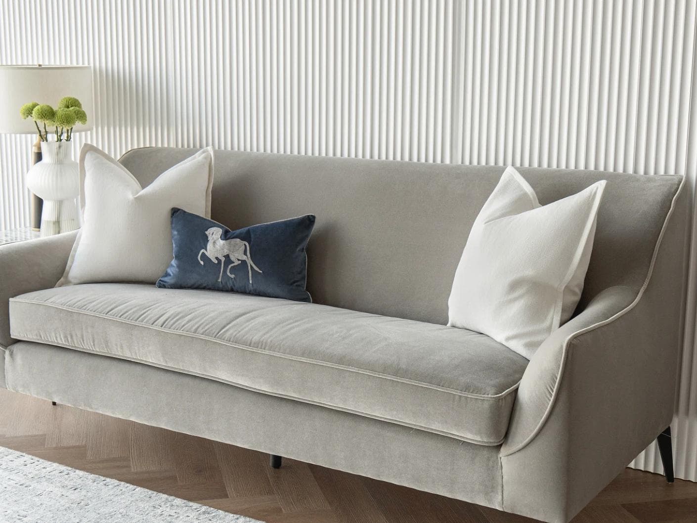 Brent Bundle cushion in white, blue and silver, shown in a lifestyle right view as image 2