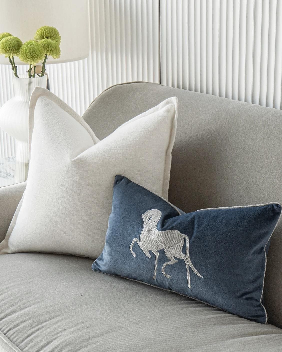 Brent Bundle cushion in white, blue and silver, shown in a lifestyle right view as image 5