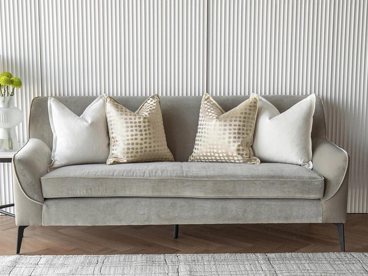 Myla Bundle cushion in white, beige and gold, shown in a lifestyle front view as image 4
