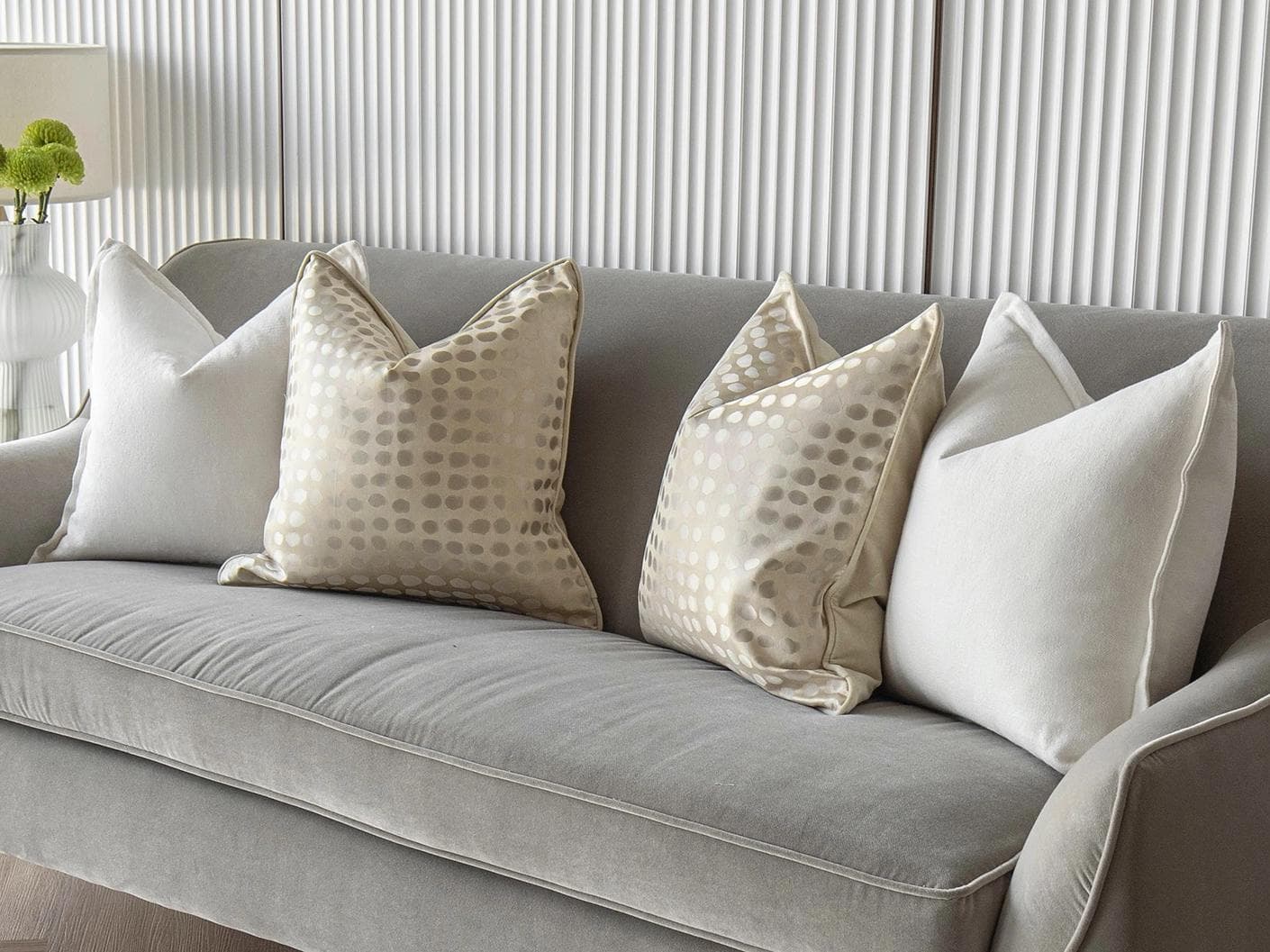 Myla Bundle cushion in white, beige and gold, shown in a lifestyle right view as image 2