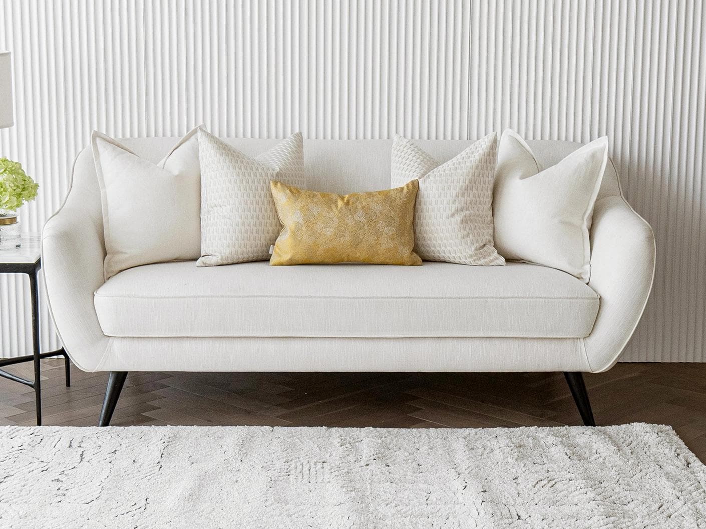 Melina Bundle cushion in white, yellow and beige, shown in a lifestyle front view as image 4