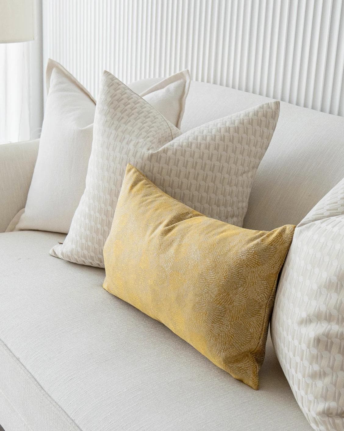 Melina Bundle cushion in white, yellow and beige, shown in a product right view as image 5