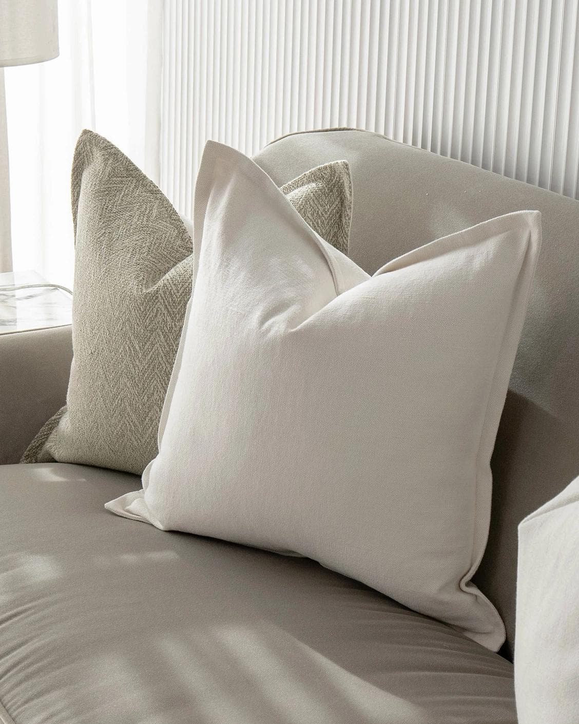 Matteo Bundle cushion in white and beige, shown in a product right view as image 5