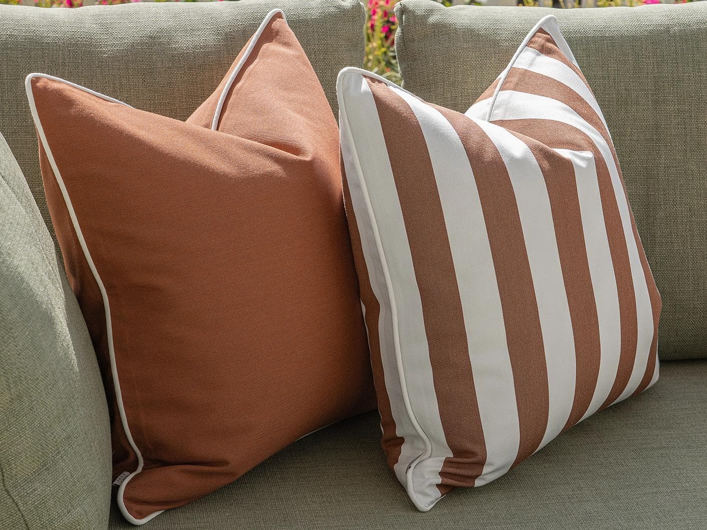 Pranvi Bundle cushion in rust and brown, shown in a lifestyle front view as image 4