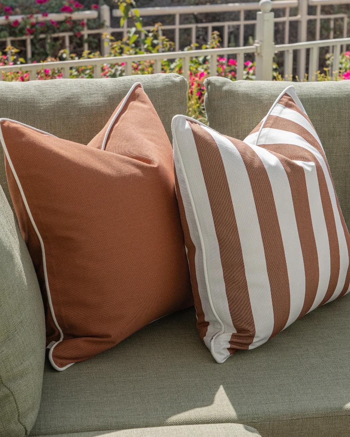Pranvi Bundle cushion in rust and brown, shown in a lifestyle front view as image 4