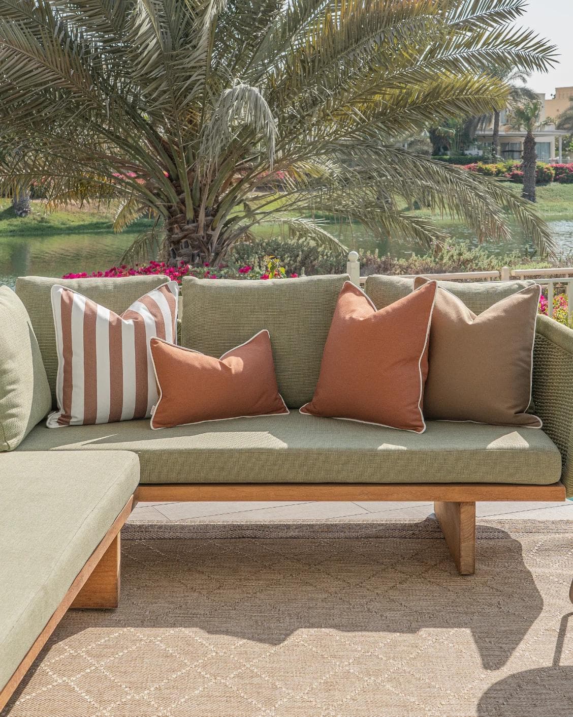 Pranvi Bundle cushion in rust and brown, shown in a lifestyle front view as image 5