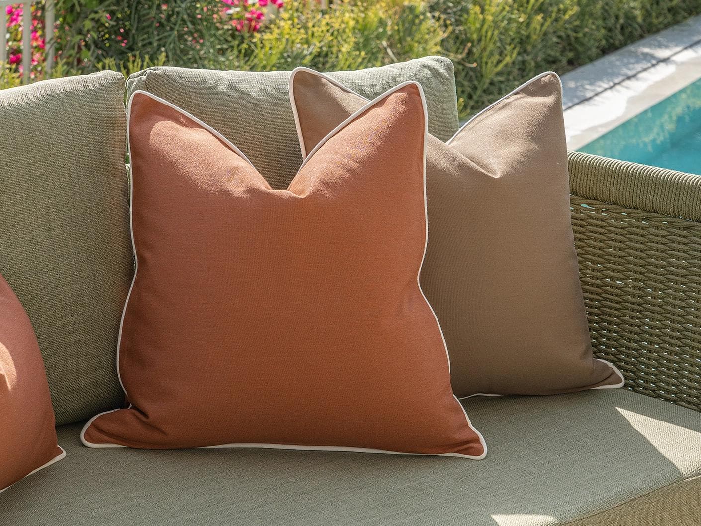 Pranvi Bundle cushion in rust and brown, shown in a lifestyle left view as image 6