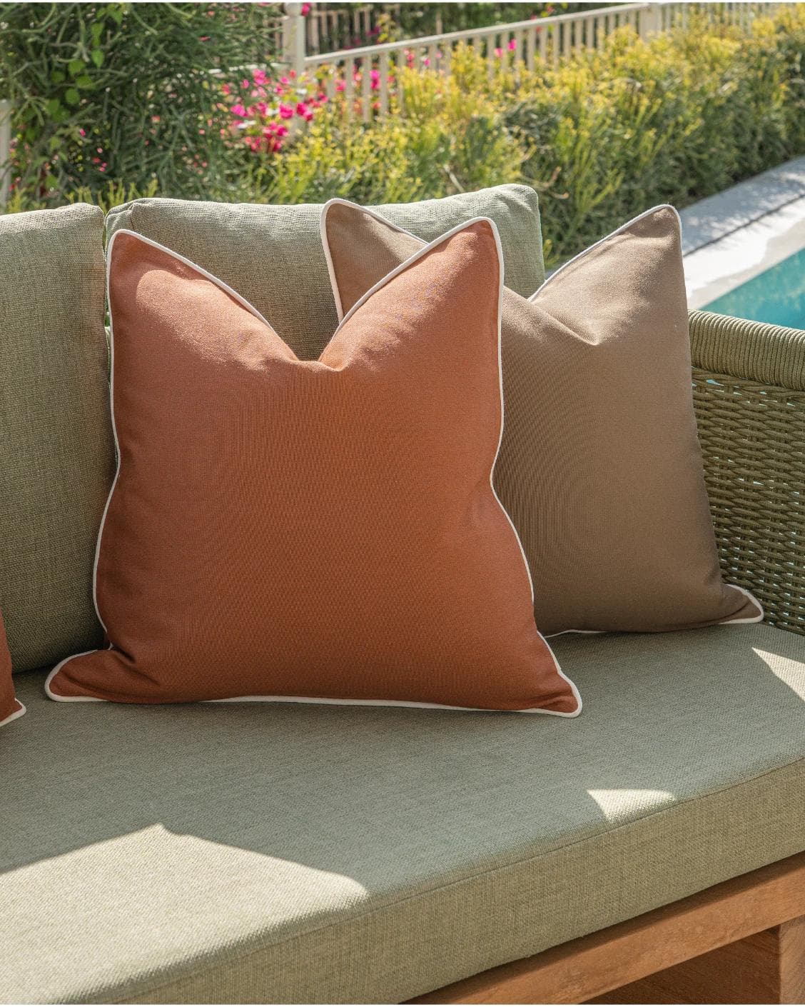 Pranvi Bundle cushion in rust and brown, shown in a lifestyle left view as image 6