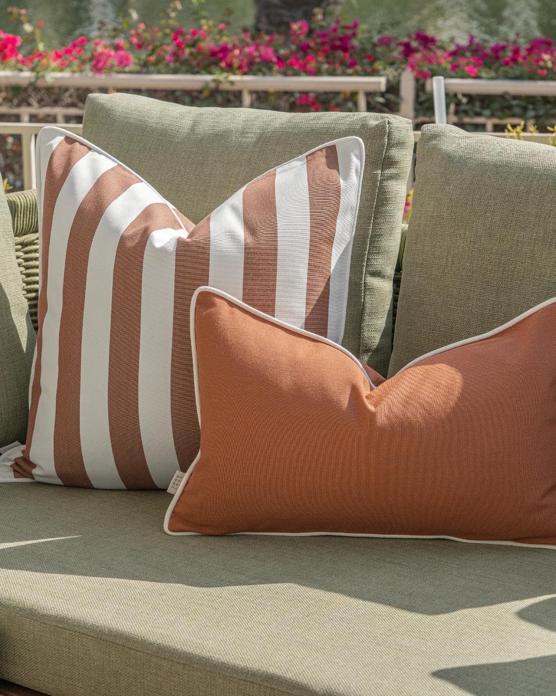 Pranvi Bundle cushion in rust and brown, shown in a lifestyle right view as image 7